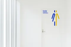 Mucho Visa Rebrand Office Environment Restroom Sign